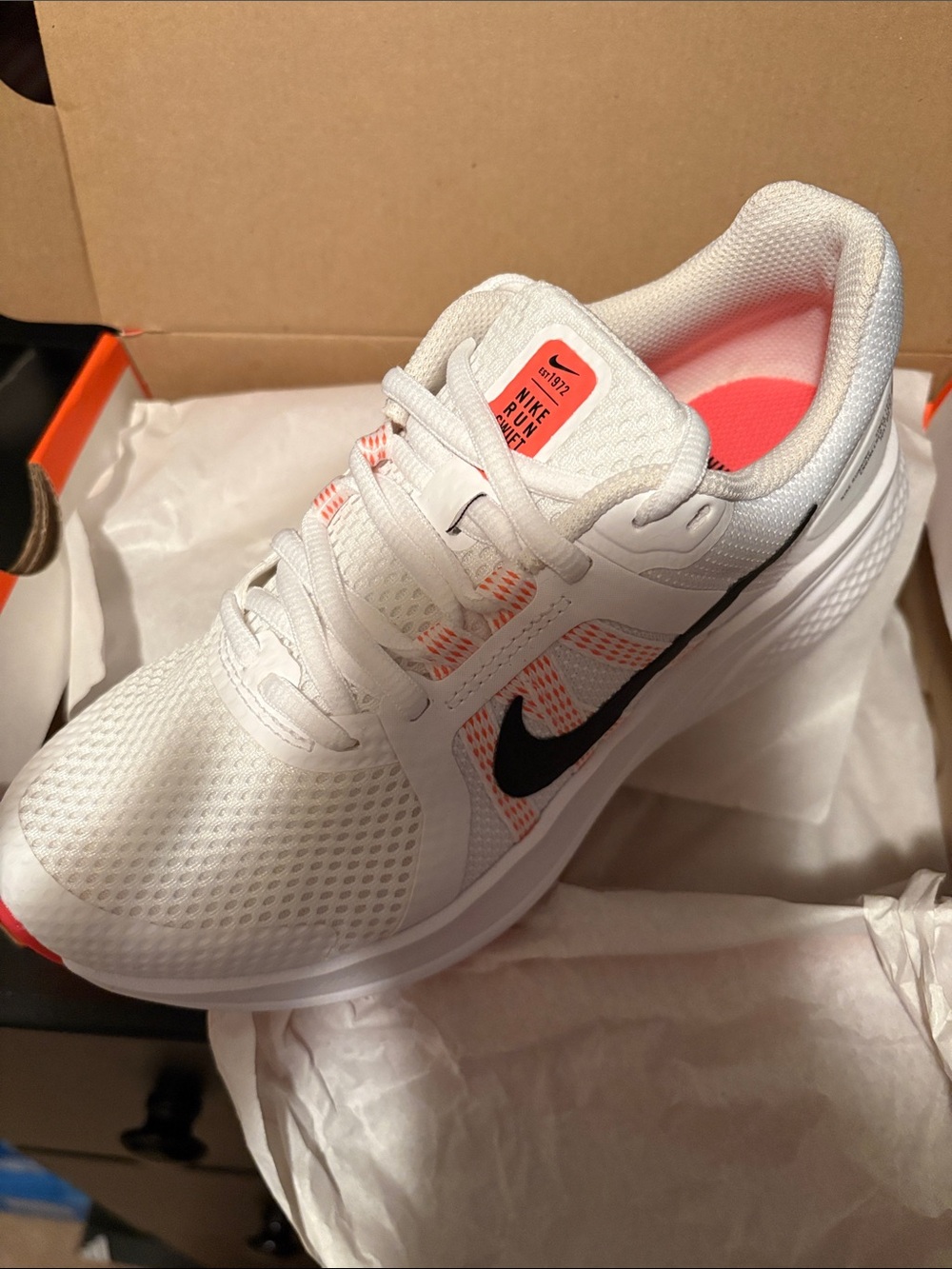 Nike Women's White Running Sneakers with Black Swoosh and Coral Accents